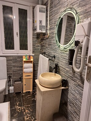 Family Suite | Bathroom | Hair dryer, slippers, bidet, towels