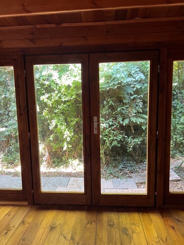 Lovely wooden accommodation surrounded by greenery