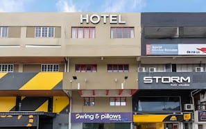 A hotel building with a sign labeled 'HOTEL' above the entrance. - Swing & Pillows @ PJ SS2 (Petaling Jaya)