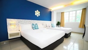 A hotel room with a large bed, two bedside tables, a wall-mounted light, and a window with curtains. - Swing & Pillows @ PJ SS2 (Petaling Jaya)