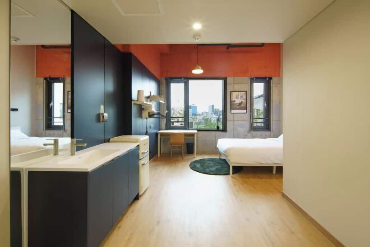 Premium bedding, desk, laptop workspace, soundproofing