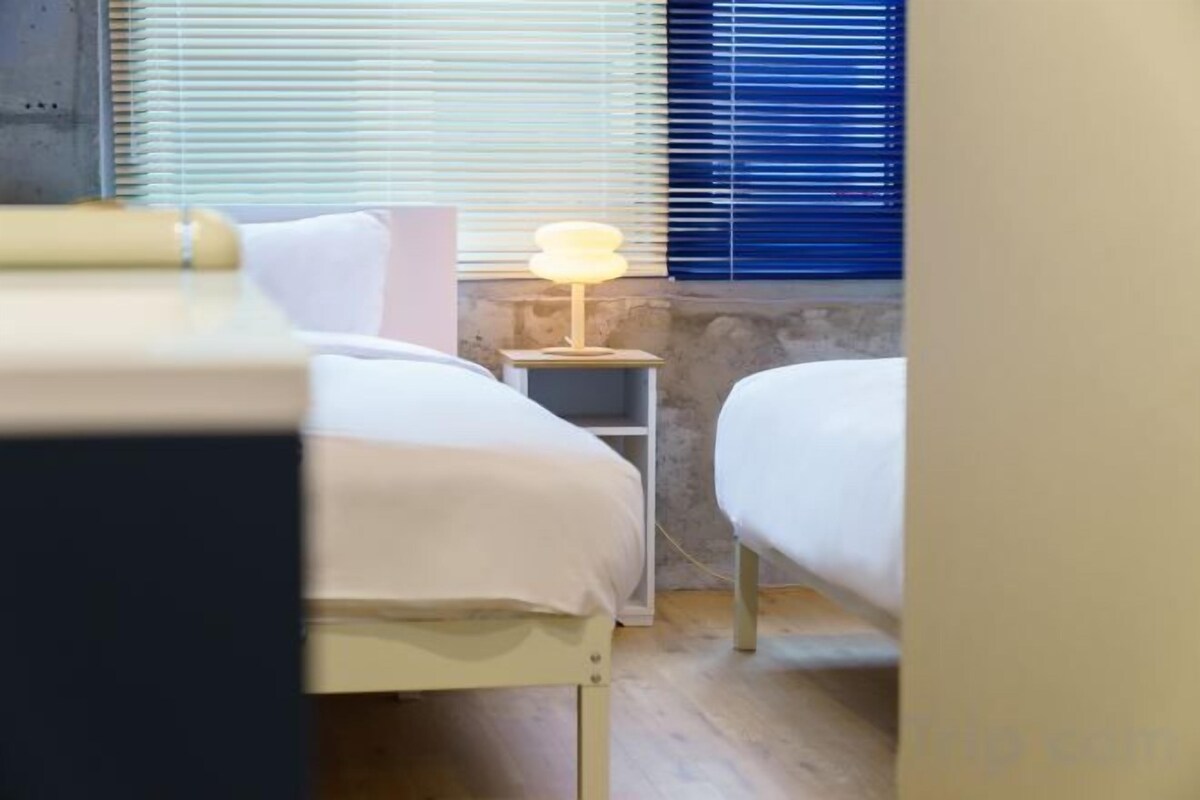 Premium bedding, desk, laptop workspace, soundproofing