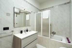 Bathtub, hair dryer, towels