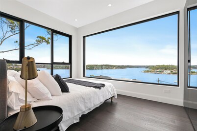 Luxury Waterside Sanctuary with pool, sensational views, 2 decks & lift!