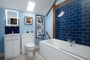 Bathtub, hair dryer, towels