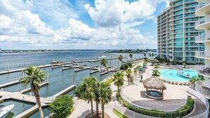 A resort with a large pool, a marina, and a view of the ocean. - Caribe Resort | Lazy River | Indoor & Outdoor Pools | Hot Tubs | Sleeps 14 (Orange Beach)