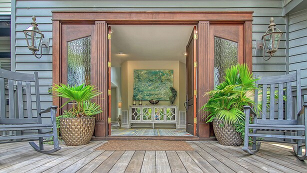 A wooden deck with two rocking chairs, a potted plant, and a bench. - New Listing in popular neighborhood (Kiawah Island)