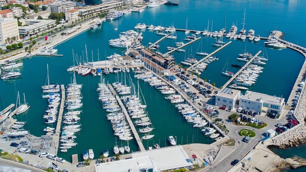 An aerial view of a marina with numerous boats docked at various piers. - Beachfront Apartment With Balcony and Parking (Split)
