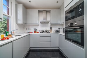 Apartment | Private kitchen | Fridge, microwave, oven, stovetop