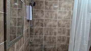 Apartment | Bathroom | Combined shower/bathtub, deep-soaking bathtub, hair dryer, towels