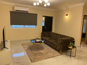 House | Living area | TV - 3 Bed Apartment Sleeps 6 - Parking, Patio, Wifi (Freetown)