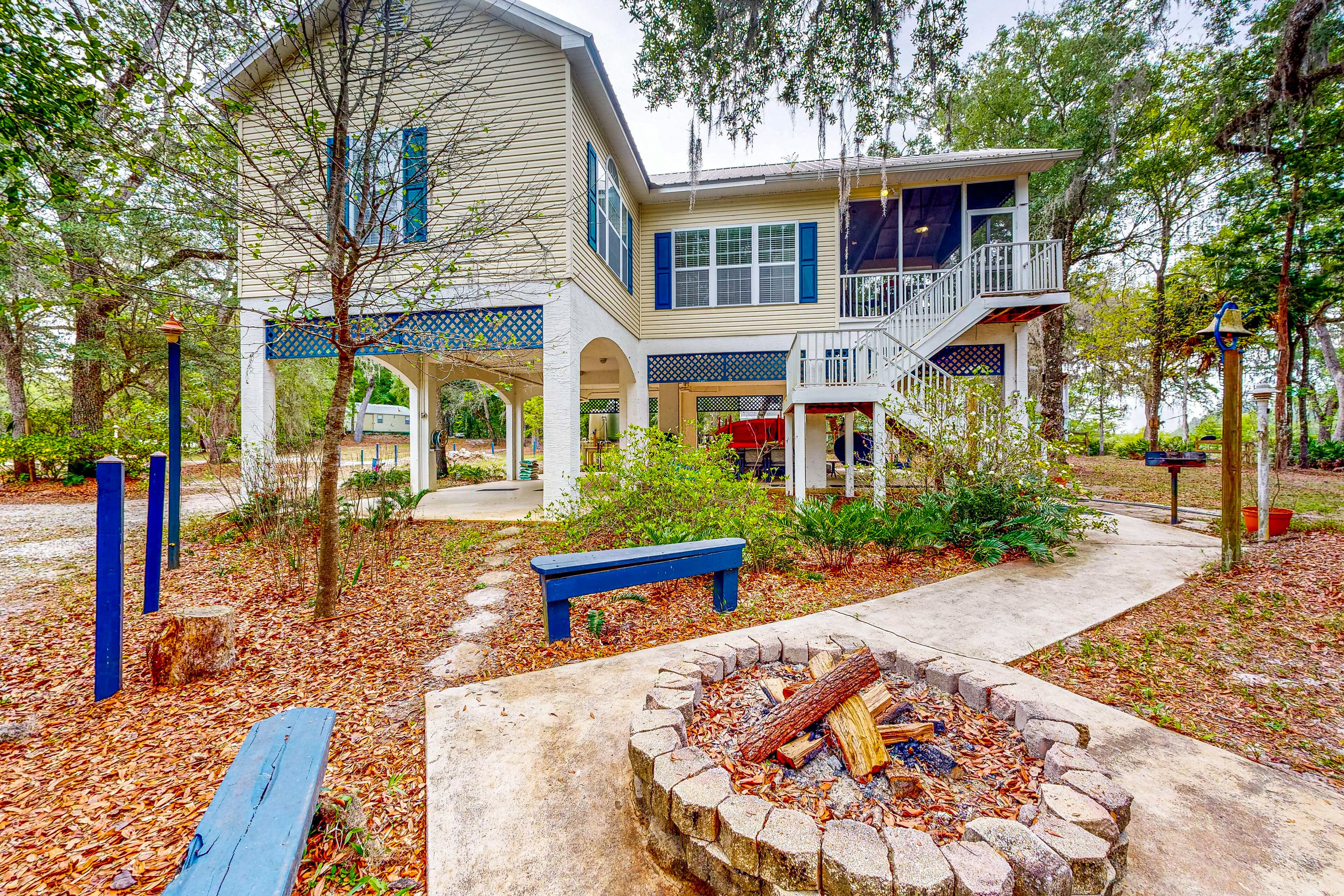 Dog-friendly riverfront home with screened porch, firepit, & private dock