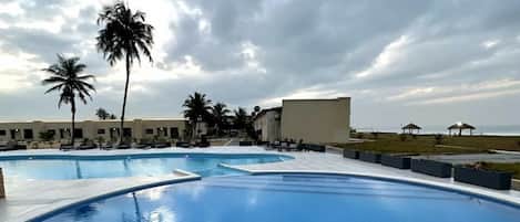 Outdoor pool, pool umbrellas, sun loungers