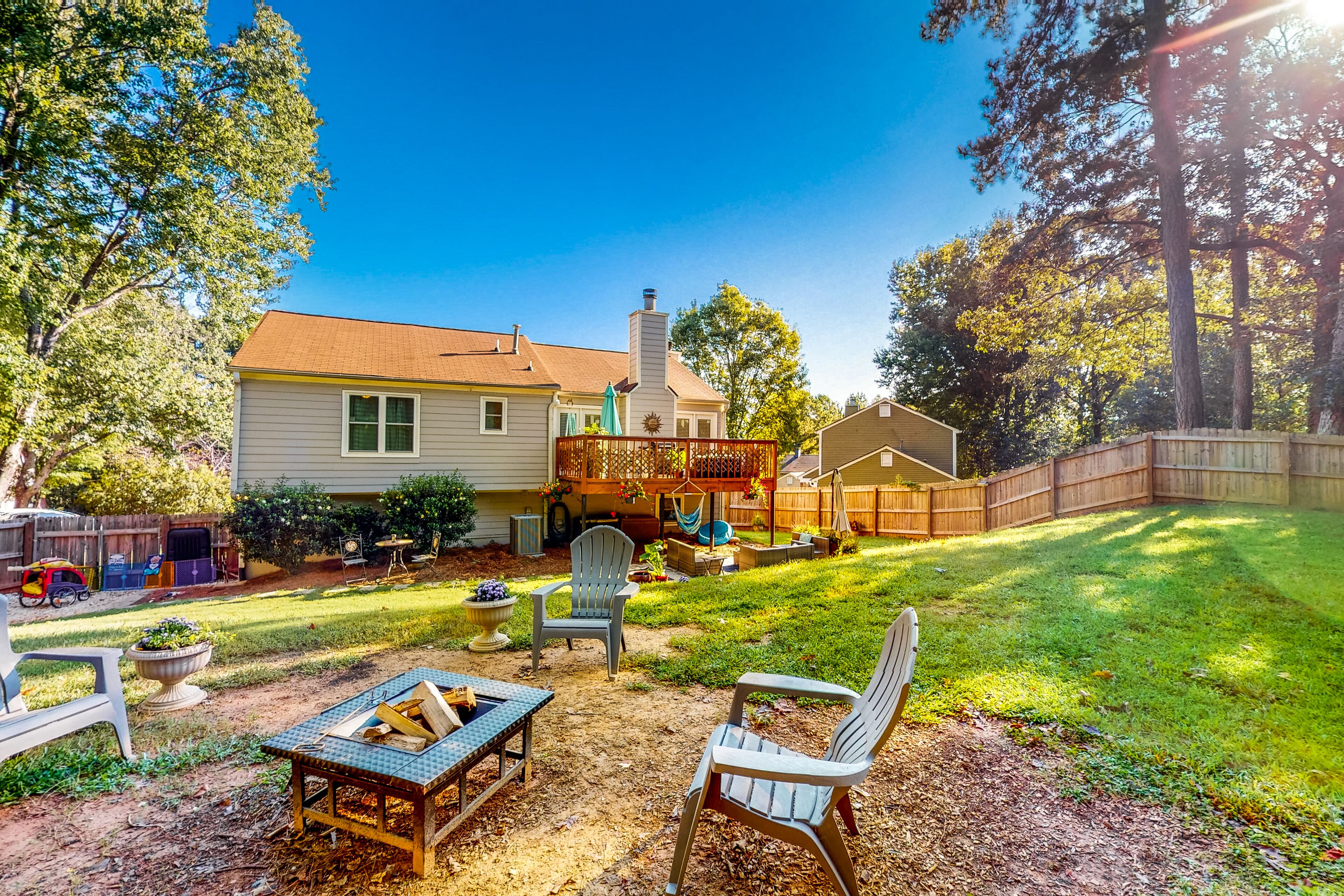 Spacious home with large, dog-friendly fenced yard, firepit, & full kitchen