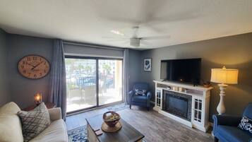 Condo, Multiple Beds, Kitchen, Pool View | Living area | 40-inch flat-screen TV with cable channels, TV, fireplace