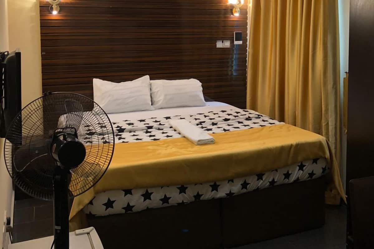 Desk, laptop workspace, bed sheets