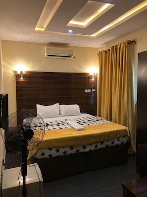 Desk, laptop workspace, bed sheets