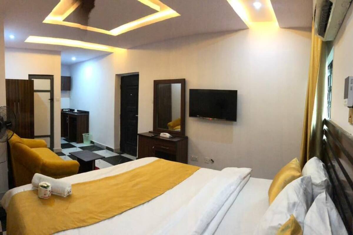 Desk, laptop workspace, bed sheets