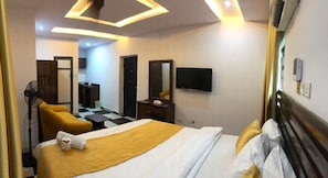 Desk, laptop workspace, bed sheets