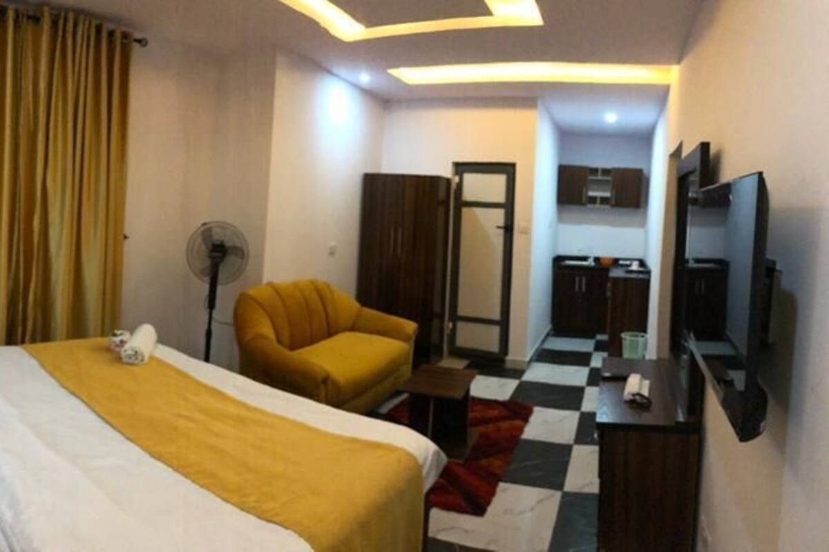 Desk, laptop workspace, bed sheets