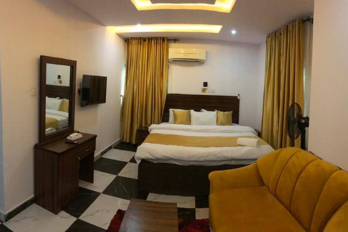 Desk, laptop workspace, bed sheets