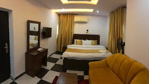 Desk, laptop workspace, bed sheets