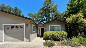 A single-story house with a garage, a front door, and a small porch area. - Prime Location, Downtown Murphys (Murphys)