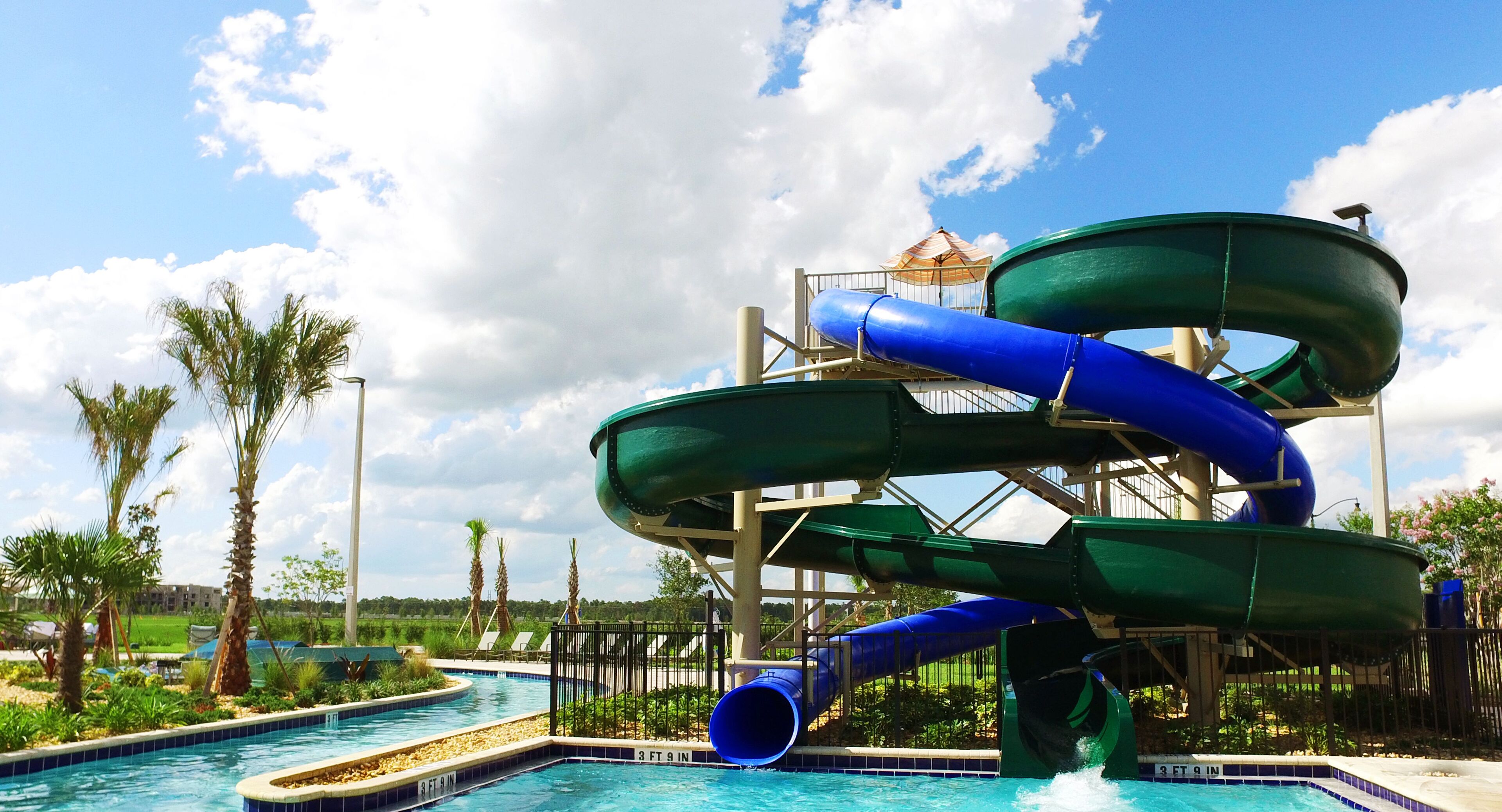 A water park with multiple slides and a pool area.