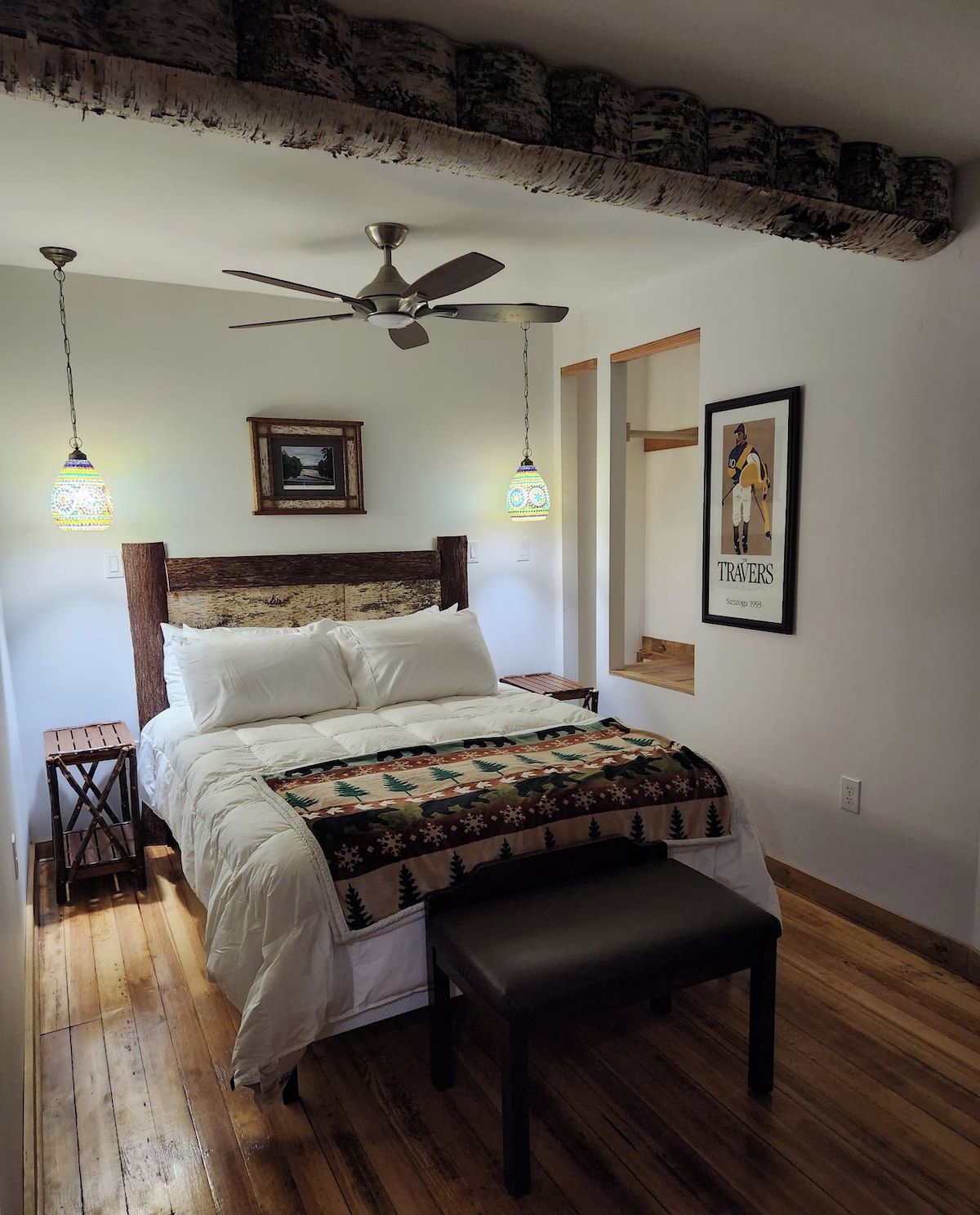 A cozy queen size bed and bedroom