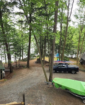 View of the property and Lake Flower from the raised deck. - Birch Suite at Colden Lodge is a Romantic Waterfront Adirondack Private Suite. (Saranac Lake)