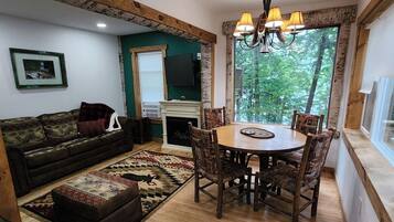 The Living room, dining area and grand picture window.