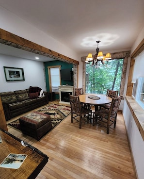 The Living room, dining area and grand picture window. - Birch Suite at Colden Lodge is a Romantic Waterfront Adirondack Private Suite. (Saranac Lake)