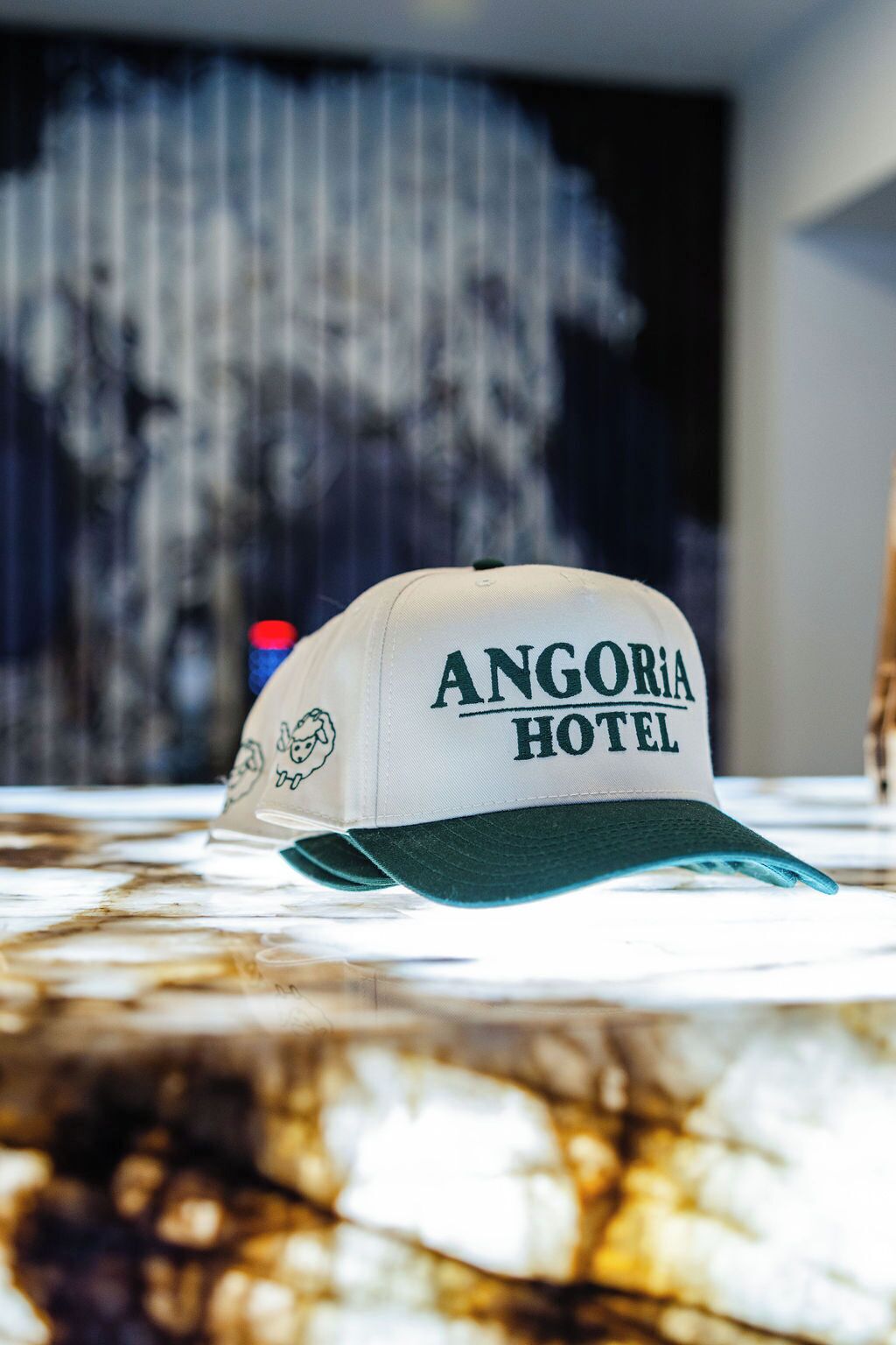 A cap with "ANGORIA HOTEL" printed on it.