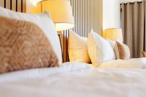 Premium bedding, memory foam beds, blackout drapes, free WiFi