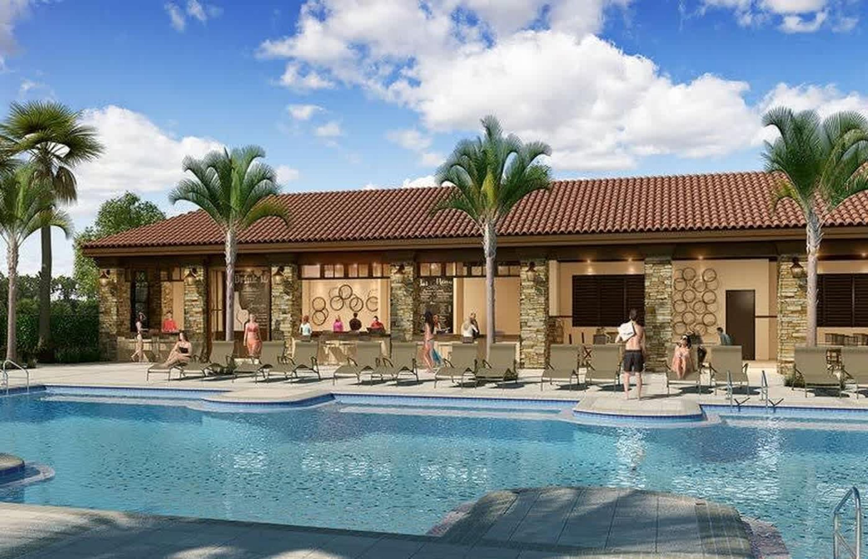A pool area with lounge chairs, palm trees, and a building with a tiled roof.