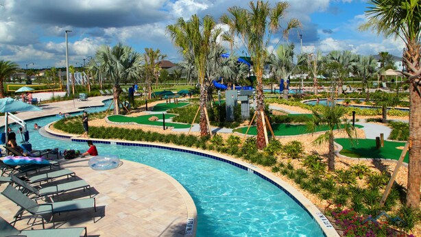 A swimming pool with lounge chairs, palm trees, and a golf course. - 5 Bedroom at Storey Lake Orlando FL Close to Disney 4851 (Kissimmee)
