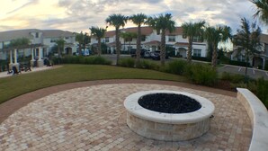 A circular stone fire pit surrounded by a brick patio. - 5 Bedroom at Storey Lake Orlando FL Close to Disney 4851 (Kissimmee)