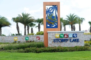 A sign with 'Storey Lake' and palm trees in the background. - Sanitized Gorgeous Family Getaway 4Bd Home w Pool Close to Disney 4983 (Kissimmee)