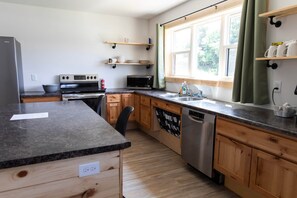 Fridge, microwave, oven, stovetop - Bluffside Gardens Oak Series 11 Person Cabin Unit 6 (Decorah)