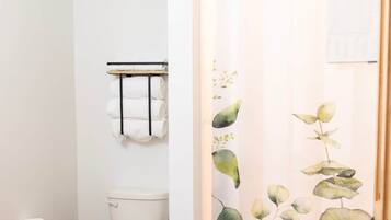 Bathtub, hair dryer, towels