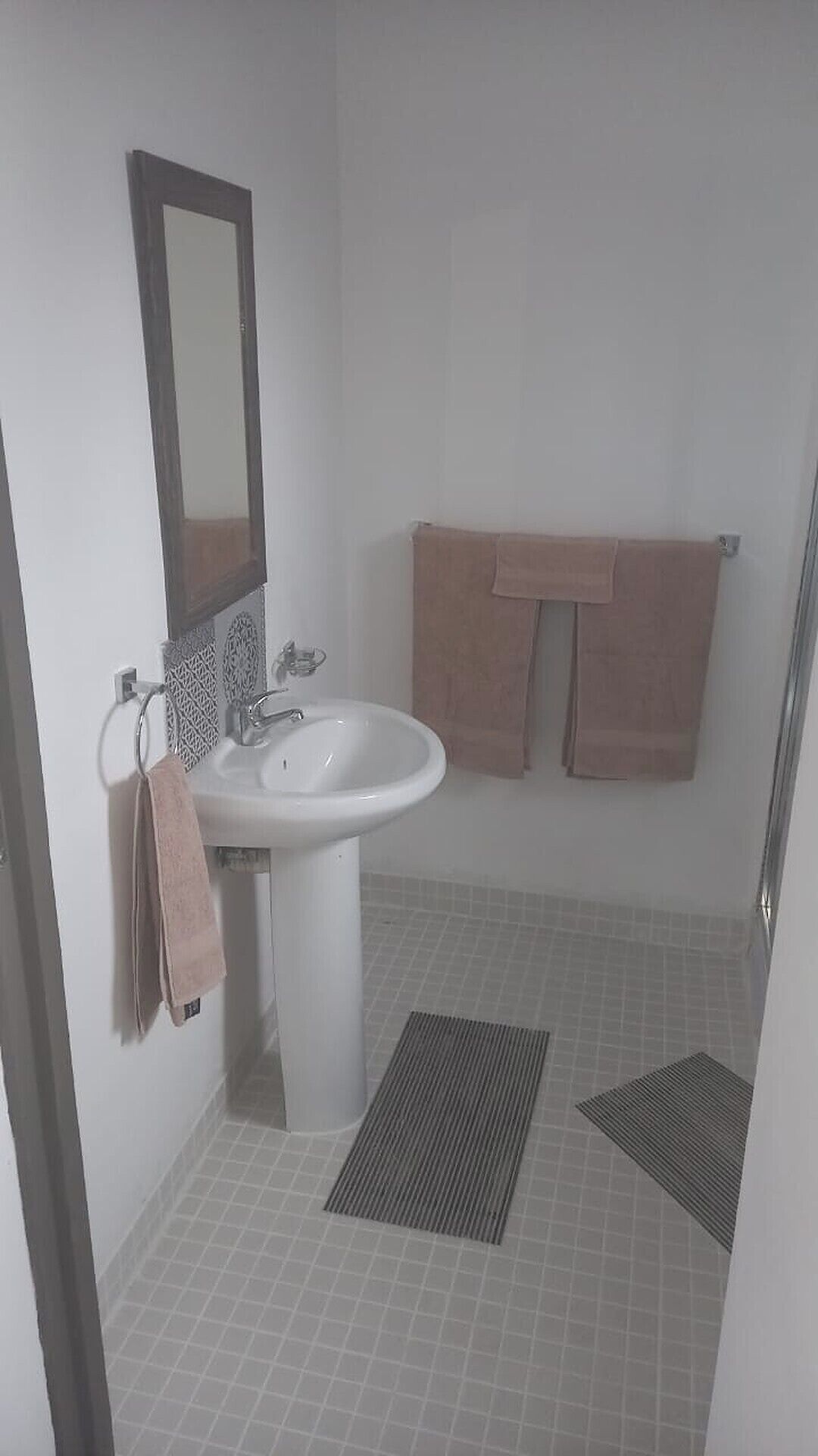 Shower, towels, soap, toilet paper