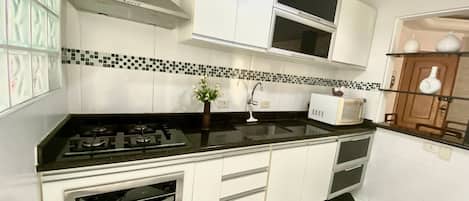 Apartment | Private kitchen | Fridge, microwave, blender, cookware/dishes/utensils