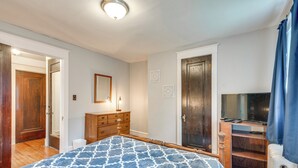 A bedroom with a bed, dresser, and a television. - 8 Mi to Elk Mountain Ski Resort: Clifford Home! (Clifford)