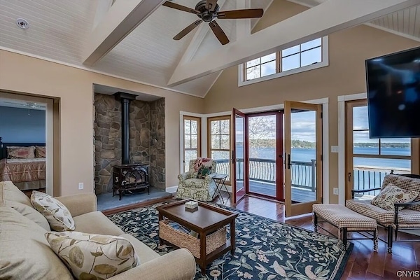 The main living area boasts a wood stove, large smart TV and unforgettable view.