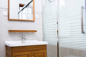 Shower, towels, soap, toilet paper