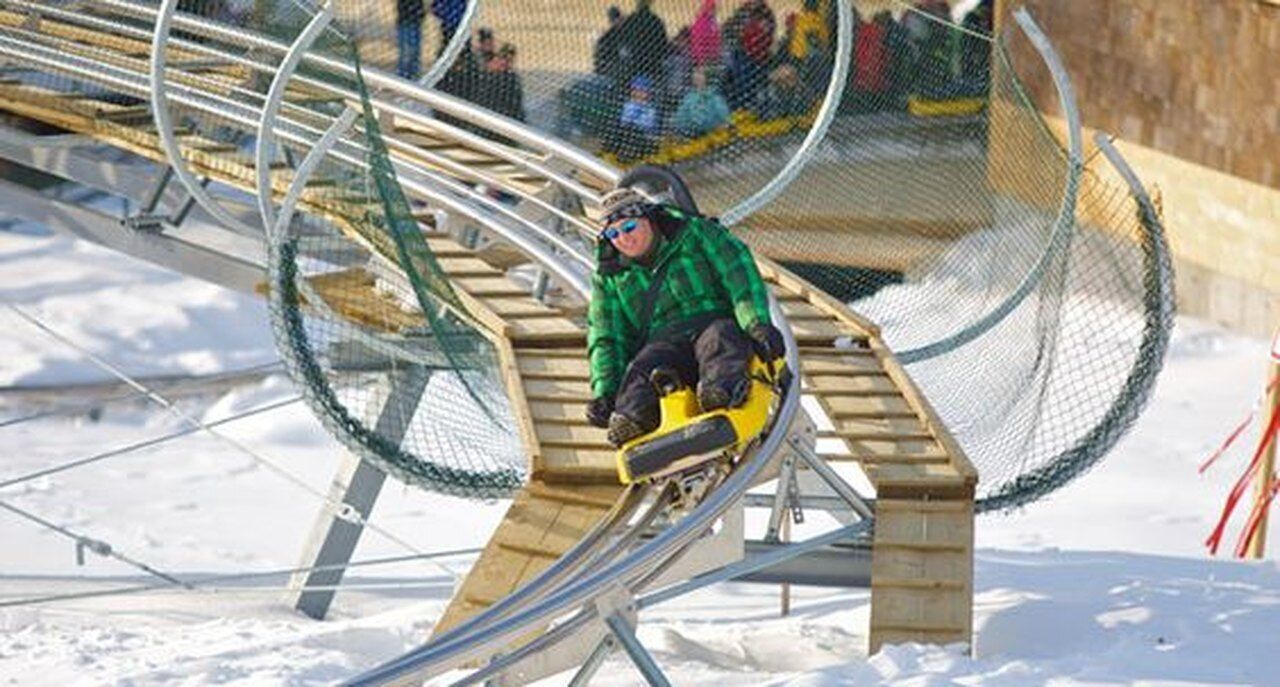 A snow slide with a person at the top.
