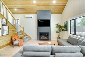 TV, fireplace, books - Modern Lakeside Cabin w/ Mountain Views & Hot Tub! (Lakeside)
