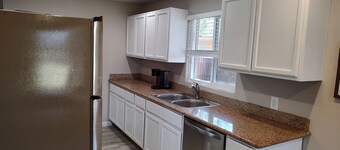 Centrally located close to everything with private entry and private yard.