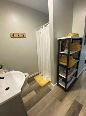 Shower, towels, soap, toilet paper