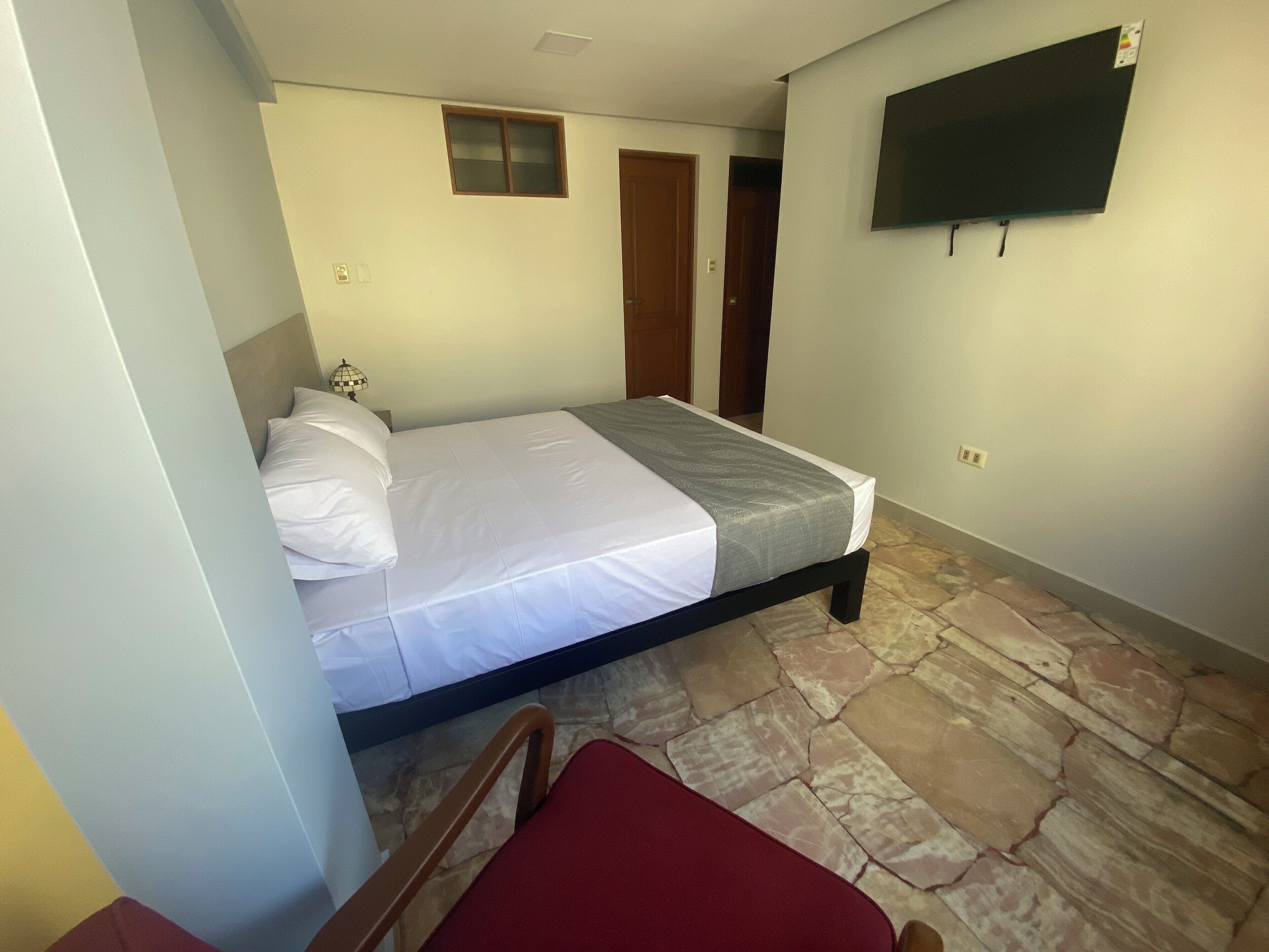 deluxe room, 1 queen bed | premium bedding, down duvets, memory-foam beds, free wifi